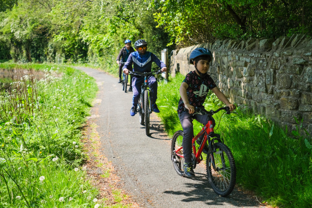 Photograph of children cycling along the canal towpath in Nelson